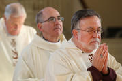 Bishop Jaime Soto of Sacramento, Calif., front right, prays during Mass in the Chapel of the Immaculate Conception at Mundelein Seminary on Jan. 3 at the University of St. Mary of the Lake in Illinois, near Chicago. The U.S. bishops are on retreat Jan. 2-8 at the seminary. (CNS photo/Bob Roller)