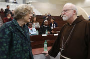 Sheila Hollins, a member of the Pontifical Commission for the Protection of Minors, talks with U.S. Cardinal Sean P. O'Malley, president of the commission, at a 2017 seminar in Rome on safeguarding children. (CNS photo/Paul Haring)