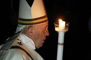 Pope Francis carries a candle in procession as he arrives to celebrate the Easter Vigil in St. Peter's Basilica at the Vatican April 20, 2019. (CNS photo/Paul Haring) 