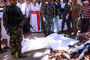 Cardinal Malcolm Ranjith of Colombo, Sri Lanka, looks at the explosion site inside a church in Negombo April 21, 2019, following a string of suicide bomb attacks on churches and luxury hotels across the island. (CNS photo/Reuters) 