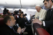 Pope Francis listens to a question from Romanian journalist Cristian Micaci aboard his flight from Sibiu, Romania, to Rome June 2, 2019. (CNS photo/Paul Haring) 