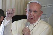 Pope Francis answers questions from journalists aboard his flight from Antananarivo, Madagascar, to Rome on Sept. 10. (CNS photo/Paul Haring)