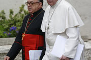 Pope Francis and Cardinal Raymundo Damasceno Assis of Aparecida, Brazil, walk to a meeting of cardinals in the synod hall at the Vatican Feb. 20, 2014. In a statement released by the Vatican Sept. 28, 2019, the pope named Cardinal Damasceno as pontifical commissioner of the Heralds of the Gospel and its religious branches for consecrated men and women. (CNS photo/Paul Haring) 