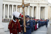 Domenico Giani, former chief of the Vatican police force, holds a cross as Vatican police officers and Swiss Guards process through St. Peter's Square in September 2016. Pope Francis appointed Gianluca Gauzzi Broccoletti, a cybersecurity expert, as the new head of the Vatican Security Services on Oct. 15. (CNS photo/Paul Haring) 