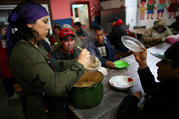 A volunteer serves a meal at a soup kitchen in Buenos Aires, Argentina, Oct. 4, 2019. Resolving the global crises of world hunger and malnutrition demands a shift away from a distorted approach to food and toward healthier lifestyles and just economic practices, Pope Francis said in an Oct. 16 message. (CNS photo/Agustin Marcarian, Reuters) 