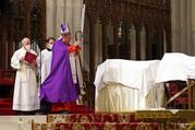 New York Cardinal Timothy M. Dolan leads a July 11, 2020, prayer service at St. Patrick's Cathedral in New York City during which he blessed the cremated remains of 250 Mexicans who had died from COVID-19. The majority of the deceased had been employed as front-line workers in the New York area. The Mexican consulate in New York helped plan the liturgy and arranged for the ashes to be transported by plane to Mexico following the service. (CNS photo/Gregory A. Shemitz) 