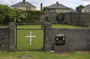 This June 4, 2014 file photo shows the site of a mass grave for children who died in the Tuam mother and baby home, in Tuam, County Galway, Ireland. The Vatican has indicated its support for a campaign to exhume the bodies of hundreds of babies who were buried on the grounds of a Catholic-run Irish home for unwed mothers to give them a proper Christian burial. (Niall Carson/PA via AP, file)