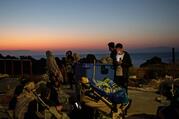 Displaced people rest on the premises of a gas station Sept. 11, 2020, after fires broke out at the Moria refugee camp on the Greek island of Lesbos. The camp, which was mostly destroyed Sept. 9, was home to at least 12,000 people, six times its maximum capacity of just over 2,000 asylum-seekers. (CNS photo/Alkis Konstantinidis, Reuters)