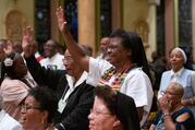 Sister Beulah Martin, a member of the Sisters of the Blessed Sacrament, center right, of Powhatan, Va., waves in Baltimore's historic St. Francis Xavier Church July 22, 2019, at a Mass honoring jubilarians during a joint conference of black priests, women religious, deacons and seminarians. (CNS photo/Kevin J. Parks, Catholic Review)