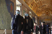 People wearing masks for protection from the coronavirus tour the Vatican Museums at the Vatican Feb. 29. (CNS photo/Paul Haring)