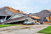 Damaged buildings and vehicles in Monroe, La., are seen in the aftermath of a tornado April 12, 2020. The National Weather Service reported April 13 that more than 30 tornadoes ripped across Texas, Louisiana, Mississippi and Georgia. (CNS photo/Peter Tuberville, social media via Reuters) 