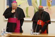 Archbishop Arthur Roche, then secretary of the congregation, left, and Cardinal Robert Sarah, then prefect of the Congregation for Divine Worship and the Sacraments, pray with U.S. bishops at the start of a meeting at the congregation at the Vatican on Jan. 14, 2020. (CNS photo/Paul Haring) 