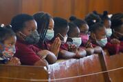 Students of Drexel Neumann Academy pray during Mass at St. Katharine Drexel Church in Chester, Pa., on May 24, 2021. (CNS photo/Sarah Webb, CatholicPhilly.com)