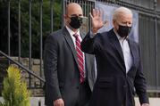 President Joe Biden waves as he leaves Holy Trinity Catholic Church in Washington after Mass on April 10. (CNS photo/Erin Scott, Reuters)