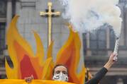 An activist takes part in a protest ahead of the 26th U.N. Climate Change Conference in Glasgow, Scotland, Oct. 28, 2021. (CNS photo/Russell Cheyne, Reuters)