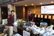 Fordham Prep students collect donations for the Great Ignatian Challenge in 2019. The annual holiday food drive, which now takes place at 15 Jesuit schools, also raises money for financial assistance programs at thge participating schools. (Christopher Lauber/Fordham Prep)