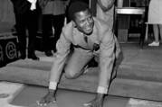 Sidney Poitier places his hands in wet cement at Grauman's Chinese Theater in Los Angeles on June 23, 1967. Poitier, the first Black actor to win an Academy Award for best lead performance, died on Jan. 6. He was 94. (AP Photo/File)