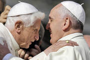 Pope Francis hugs Pope Emeritus Benedict XVI prior to the start of a meeting with elderly faithful in St. Peter's Square at the Vatican, Sunday, Sept. 28, 2014.