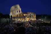 People gather outside Rome's Colosseum April 19, 2019, before Pope Francis leads the Way of the Cross.