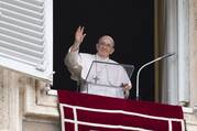 Pope Francis greets the crowd as he leads the “Regina Coeli” prayer from the window of his studio overlooking St. Peter's Square at the Vatican May 8, 2022.