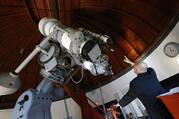 Gabriele Gionti, S.J., an astronomer, points to a 1935 Zeiss telescope during a tour for media representatives of the Vatican Observatory at the papal villa at Castel Gandolfo.