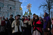 People in traditional clothes singing carols at St. Sophia Cathedral in Kyiv, Ukraine, Dec 25, 2021. (iStock)