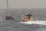 Coast Guard Station Islamorada small boat crew follows an overloaded sailing vessel off Rodriguez Key, Florida, Nov. 21, 2022. Rescue crews battled six to ten feet seas and 25 miles per hour winds to safely remove the people from the vessel. (U.S. Coast Guard photo by Lt. Robert Collins)