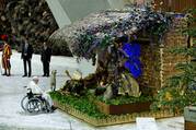 Pope Francis visits a Nativity scene during an audience with the donors of the Vatican Christmas tree and the Nativity scenes, in the Paul VI hall at the Vatican.