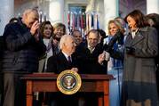 President Joe Biden holds up his pen after signing 8nto law the Respect for Marriage Act, a landmark bill protecting same-sex marriage, on the South Lawn at the White House in Washington Dec. 13, 2022. (CNS photo/Kevin Lamarque, Reuters)