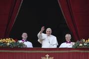 Pope Francis greets the crowd as he leads his Christmas message and his blessing "urbi et orbi" (to the city and the world) from the central balcony of St. Peter's Basilica at the Vatican Dec. 25, 2022. (CNS photo/Paul Haring)