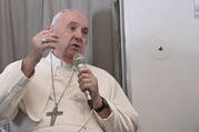 Pope Francis meets the journalists during an airborne press conference aboard the airplane directed to Rome, at the end of his pastoral visit to Congo and South Sudan, Sunday, Feb. 5, 2023. (Tiziana Fabi/Pool Photo Via AP)