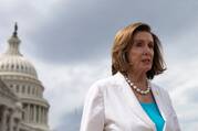 Former Speaker of the House Nancy Pelosi stands in front on the U.S. Capitol