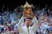 Serbia's Novak Djokovic poses with the Wimbledon trophy in London July 14, 2019, after defeating Switzerland's Roger Federer in five sets. (CNS photo/Andrew Couldridge, Reuters)