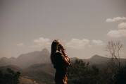 woman praying in a field