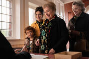 A still photo from ‘The Miracle Club’ shows Agnes O'Casey, Kathy Bates and Maggie Smith standing together in front of a desk.