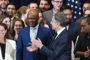 Ambassador-at-Large John Nkengasong, new head of the Bureau of Global Health Security and Diplomacy at the State Department, center left, is applauded by Secretary of State Antony Blinken after a group staff photo at an event announcing the launch of the Bureau of Global Health Security and Diplomacy at the State Department, Tuesday, Aug. 1, 2023, at the State Department in Washington. (AP Photo/Jacquelyn Martin)