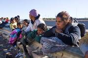 Migrants from Venezuela wait next to people from other nationalities who are in line to be processed by the U.S. Border Patrol in El Paso, Texas, Jan. 4, 2023. (OSV News photo/Paul Ratje, Reuters)