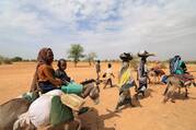 Sudanese families fleeing the conflict in Sudan's Darfur region, make their way through the desert after they crossed the border between Sudan and Chad to seek refuge in Goungour, Chad, May 12, 2023. (OSV News photo/Zohra Bensemra, Reuters)