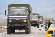 Vehicles of Russian peacekeepers leaving Azerbaijan's Nagorno-Karabakh region for Armenia pass an Armenian checkpoint on a road near the village of Kornidzor on Sept. 22, 2023. (OSV news photo/Irakli Gedenidze, Reuters)