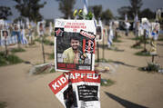 A poster depicting the Israeli-American hostage Hersh Goldberg-Polin is displayed in Re'im, southern Israel at the Gaza border, on Feb. 26, 2024, at a memorial site for the Nova music festival site where he was kidnapped by Hamas on Oct. 7, 2023. (AP Photo/Maya Alleruzzo, File)