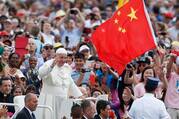 China's flag is seen as Pope Francis greets the crowd during his general audience in St. Peter's Square at the Vatican