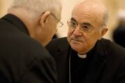 Archbishop Carlo Maria Vigano, apostolic nuncio to the United States, talks with a U.S. bishop during the bishops' meeting in Baltimore in this Nov. 13, 2012, file photo (CNS photo/Nancy Phelan Wiechec).
