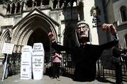 Anti-euthanasia protesters demonstrate outside the Royal Courts of Justice in London in July 2017.  (CNS photo/Neil Hall, Reuters)