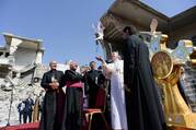 Pope Francis releases a white dove during a memorial prayer for the victims of the war at Hosh al-Bieaa (church square) in Mosul, Iraq, in this March 7, 2021, file photo. Being against war demands courageous craftsmanship, the pope wrote in the forward to a new book. (CNS photo/Vatican Media)