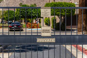 The closed fence in front of a gated community, with signs reading "Resident entrance" and "Private."  (iStock/HABesen)