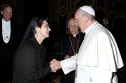 Pope Francis greets Sister Raffaella Petrini, an Italian member of the U.S.-based Franciscan Sisters of the Eucharist, at the Vatican Dec. 3, 2015 (CNS photo/Vatican Media via Reuters).