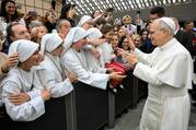 Pope Leo XIV greets religious sisters during a meeting with officials and employees of the Roman Curia, Vatican City State and the Diocese of Rome in the Paul VI Audience Hall at the Vatican May 24, 2025. (CNS photo/Vatican Media)