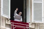 Pope Leo XIV waves to the crowd in St. Peter's Square at the Vatican as they join him for the recitation of the Angelus prayer and an appeal for peace hours after the U.S. bombed nuclear enrichment facilities in Iran on June 22. (CNS photo/Vatican Media)