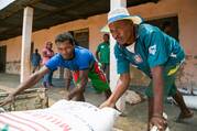 Workers unload food commodities from Catholic Relief Services and USAID in the village of Behera, near Tulear, Madagascar, Oct. 22, 2016. (OSV News Photo/Nancy McNally, Catholic Relief Services)