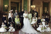 An official wedding photo of Britain's Prince Harry and Meghan Markle, center, in Windsor Castle, Windsor, England. Others in photo from left, back row, Jasper Dyer, Camilla, Duchess of Cornwall, Prince Charles, Doria Ragland, Prince William; center row, Brian Mulroney, Prince Philip, Queen Elizabeth II, Kate, Duchess of Cambridge, Princess Charlotte, Prince George, Rylan Litt, John Mulroney; front row, Ivy Mulroney, Florence van Cutsem, Zalie Warren, Remi Litt. (Alexi Lubomirski/Kensington Palace via AP)